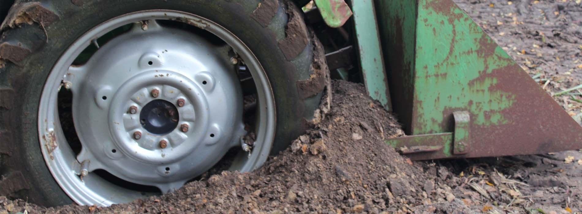 Tractor wheel stuck in the mud